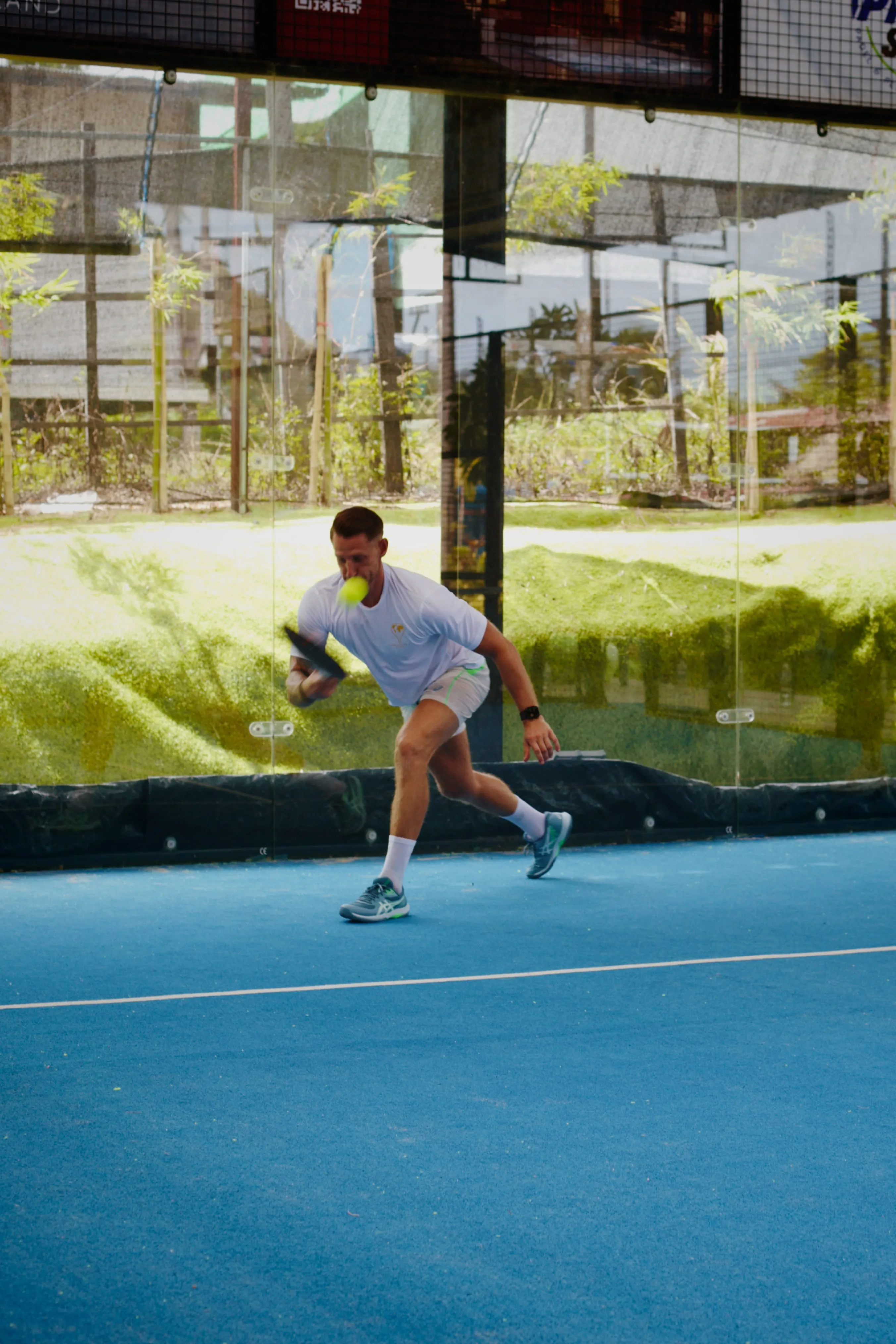 A low volley during a coached match in Koh Samui