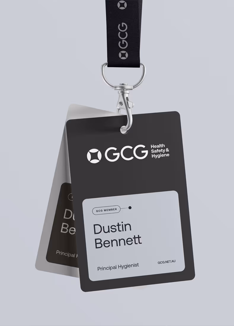 GCG branded black and white employee ID card for Dustin Bennett, attached to a black lanyard
