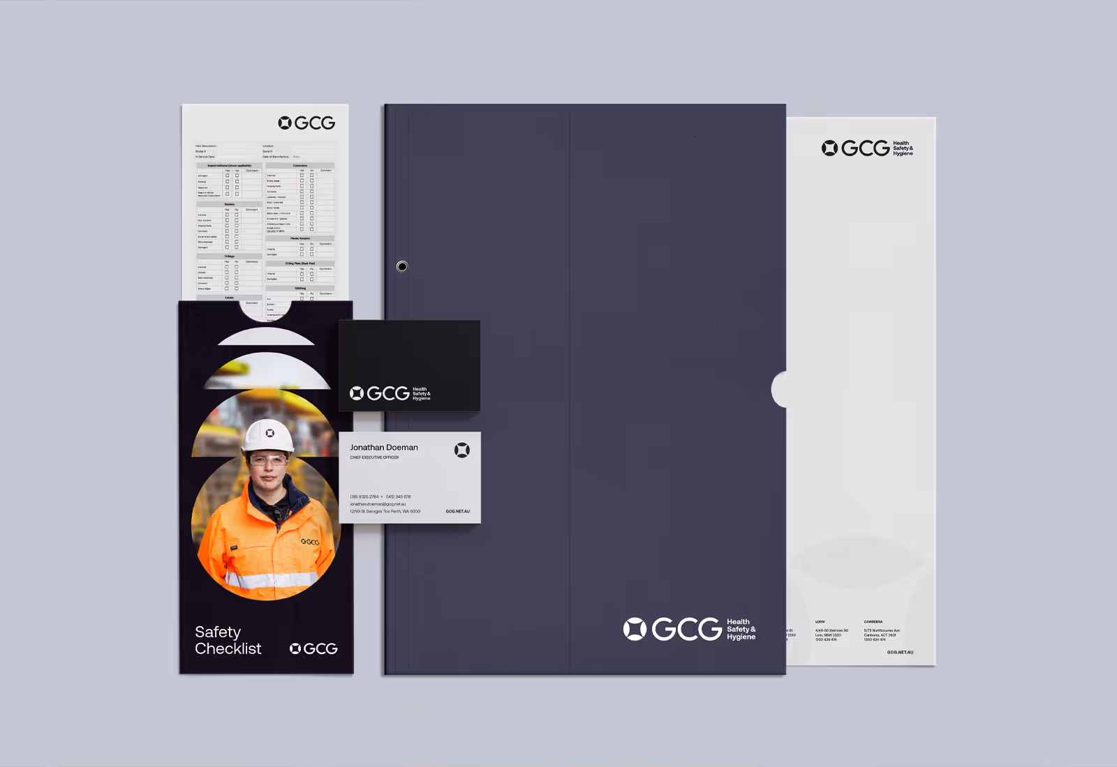 Set of GCG branded corporate stationery, safety checklist, and business cards