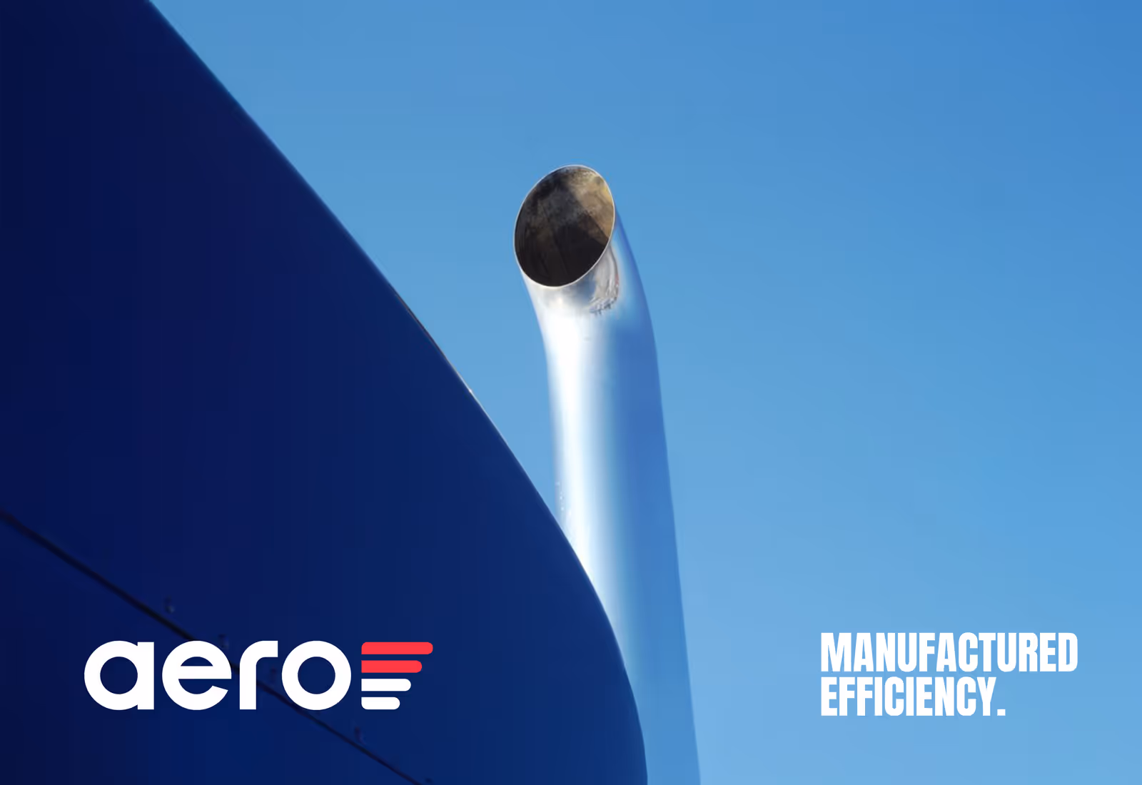 Aero exhaust pipe detail against a bright blue sky with branding text