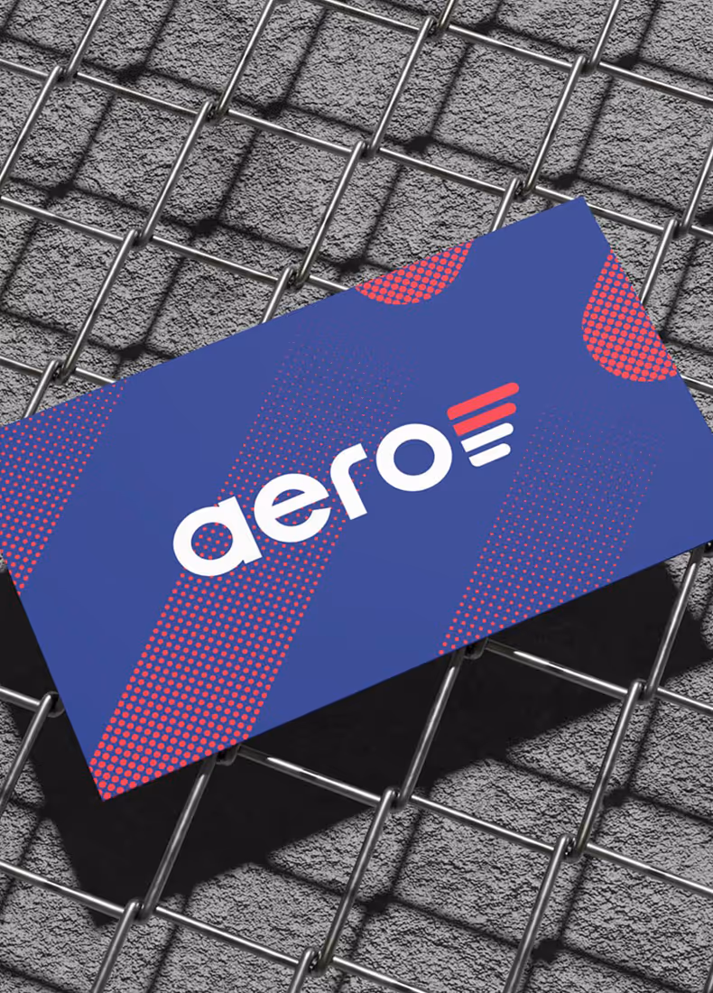 Aero branded business card on textured metal fence surface