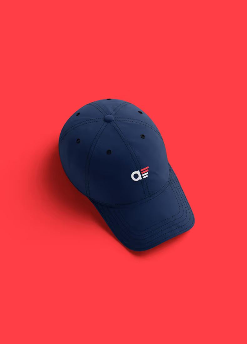 Navy blue baseball cap with Aero embroidered logo on red background