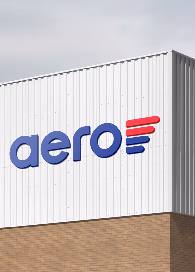 Aero logo signage mounted on corrugated metal building facade