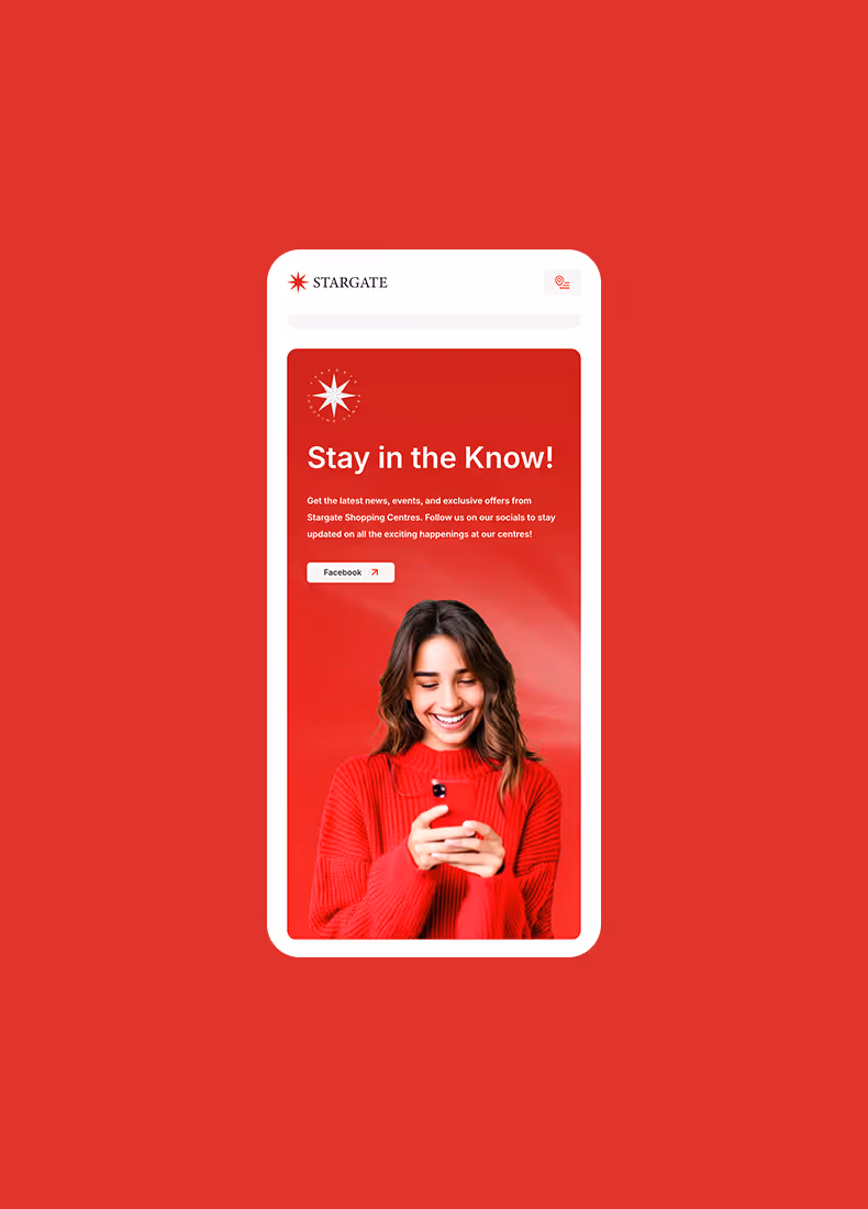 Woman in bright red sweater smiling while using a smartphone on a red background