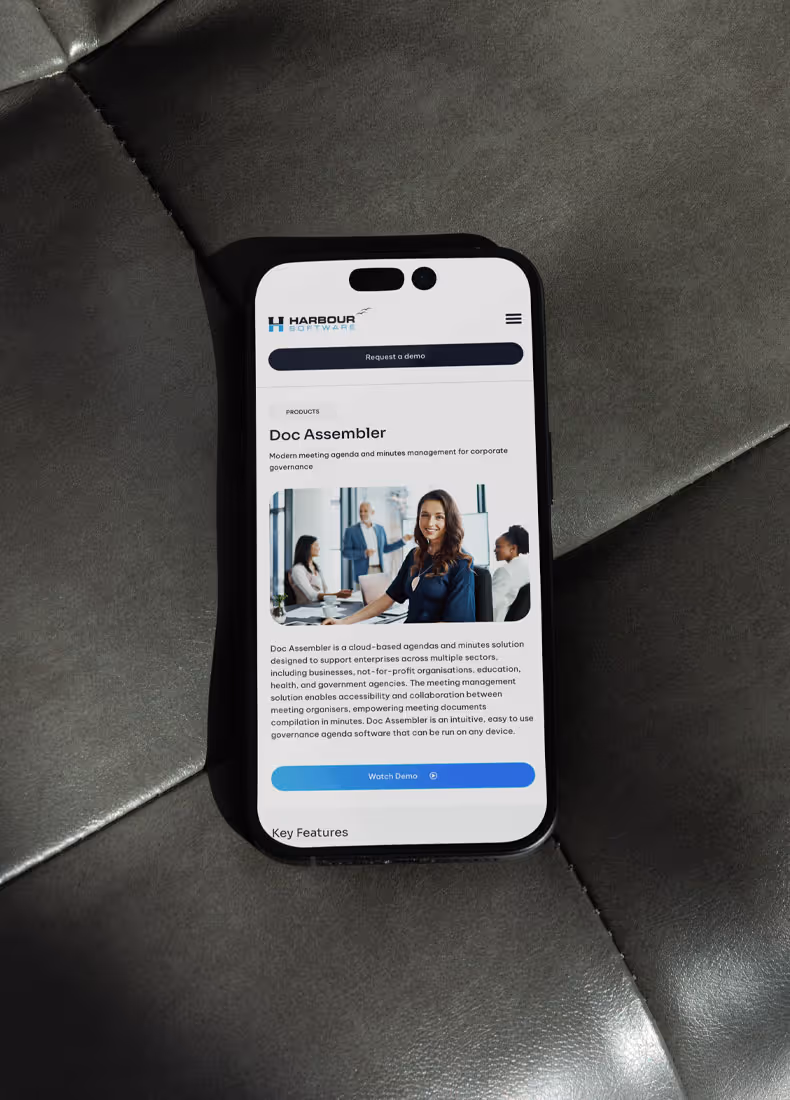 Smartphone view of Doc Assembler product page with meeting photo.