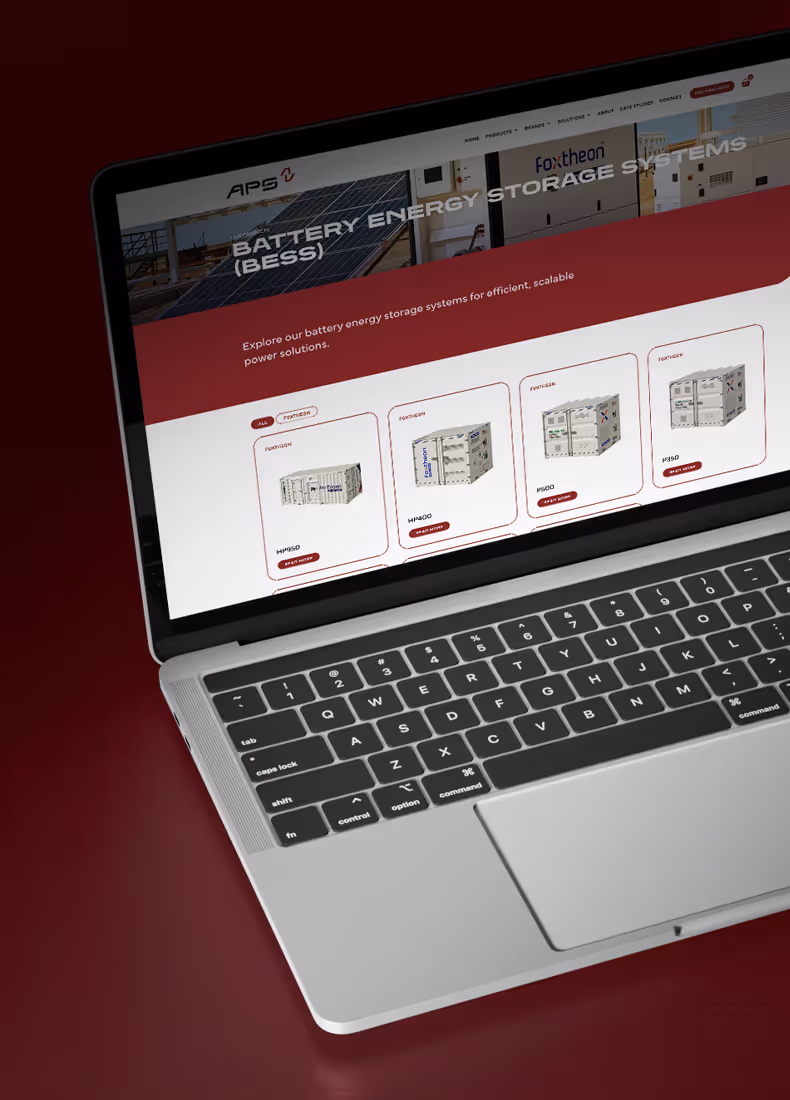 APS website battery energy storage systems category page displayed on a laptop screen, showcasing multiple Foxtheon container units.