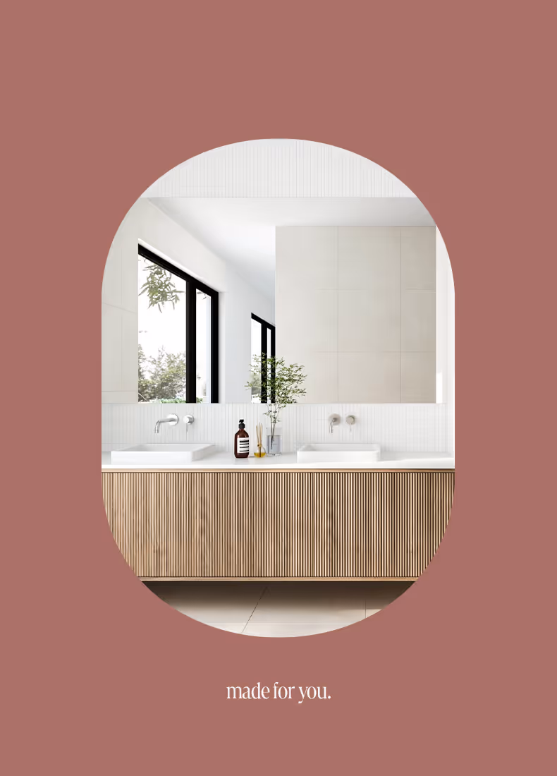 Close-up of modern double vanity with timber paneling and minimal styling from Onemade.