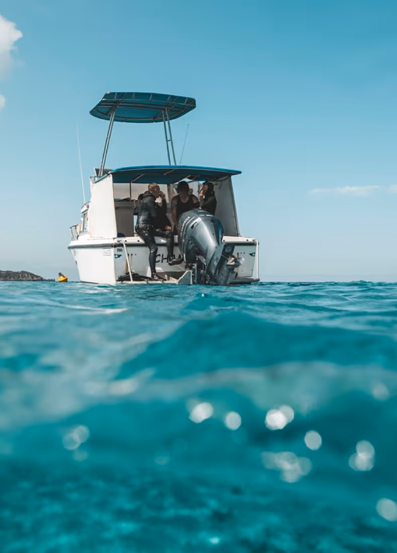 Fremantle Seaweed team on a boat in open water, preparing for marine activity.