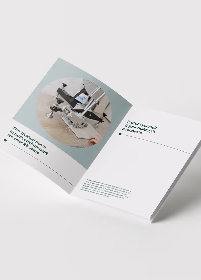 QED print brochure open to a spread showing slip testing equipment and brand messaging about occupant safety.