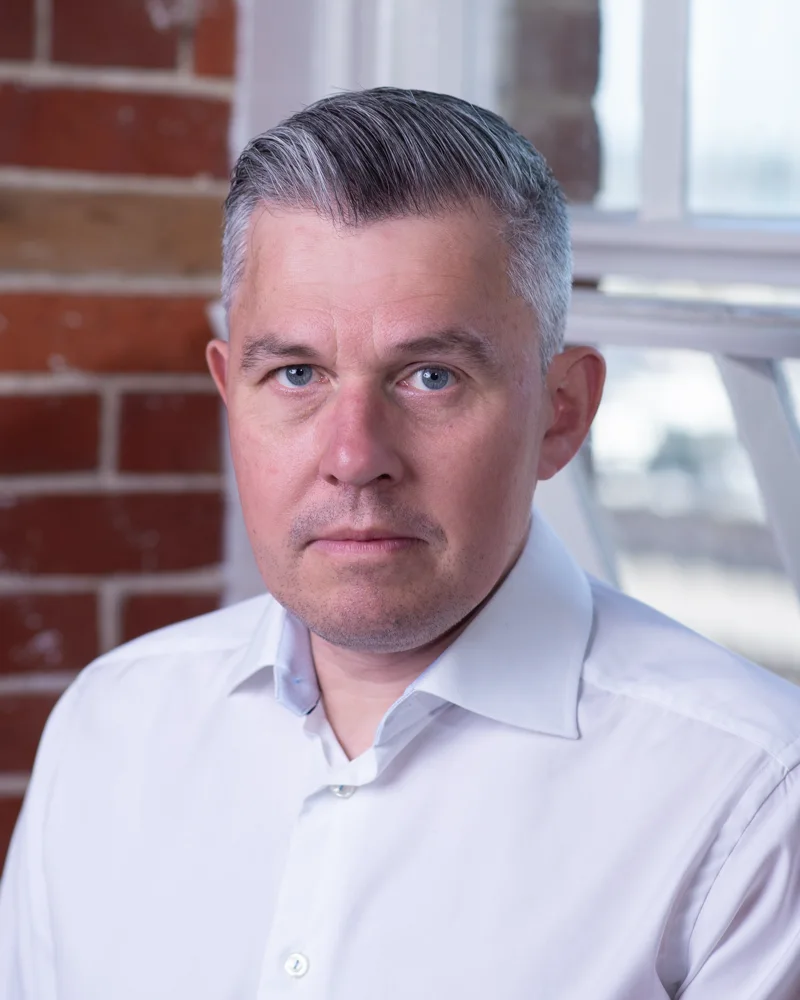 Headshot of John Bartlett, CTO of BCi Digital