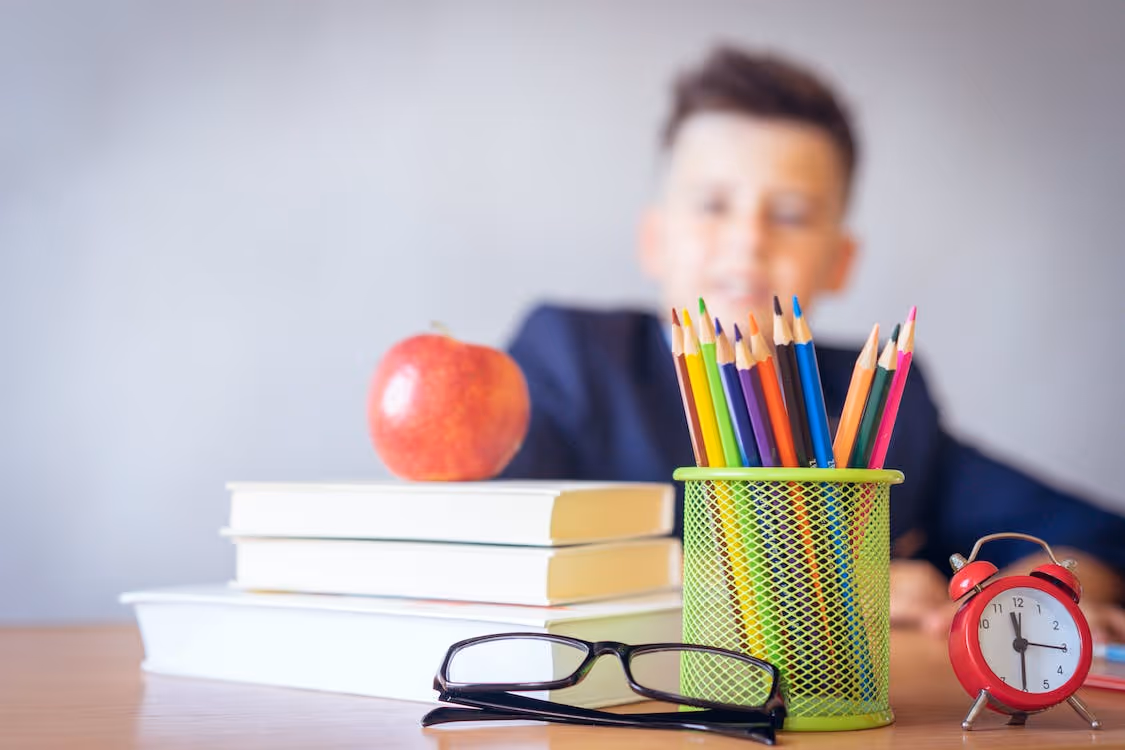 Free Boy Looking On A Tidied Desk Stock Photo