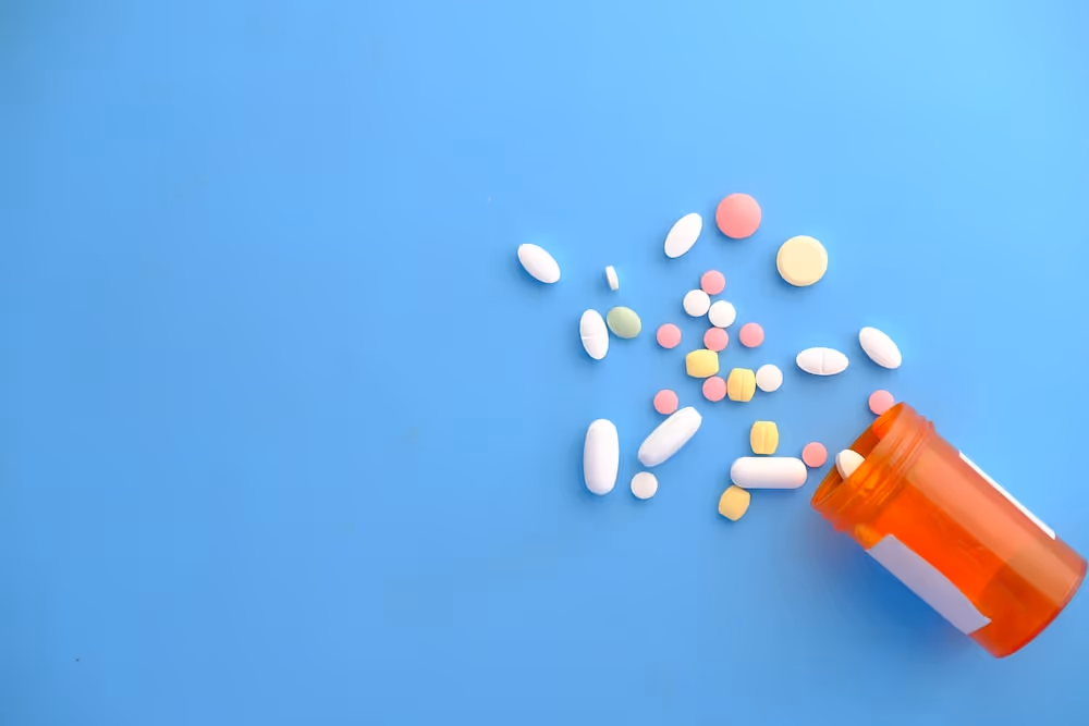 orange and white medication pill