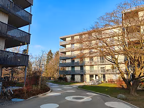 large apartment building on a sunny day