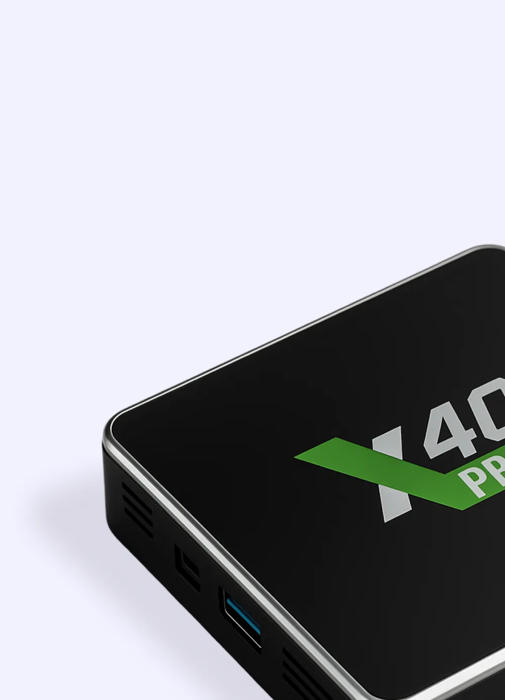 Nahaufnahme einer schwarzen Android-Media-Player-Box mit der Aufschrift „X40 Pro" und grünem X-Logo, mit sichtbarem USB-Anschluss an der Seite