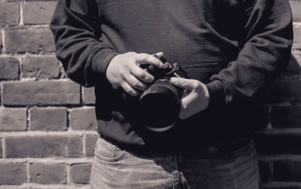 Andy Watts Photography - Andy holding a camera