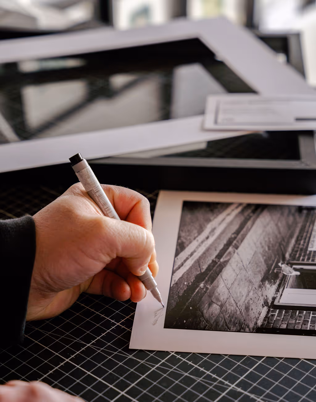 Andy Watts signing a photograph 