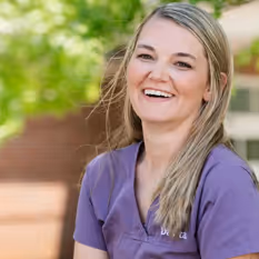 A happy nurse smiles