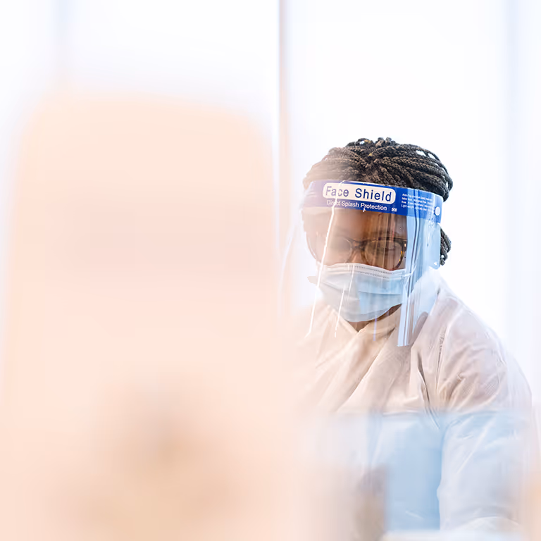 A DaVita patient care technician in a stylized shot