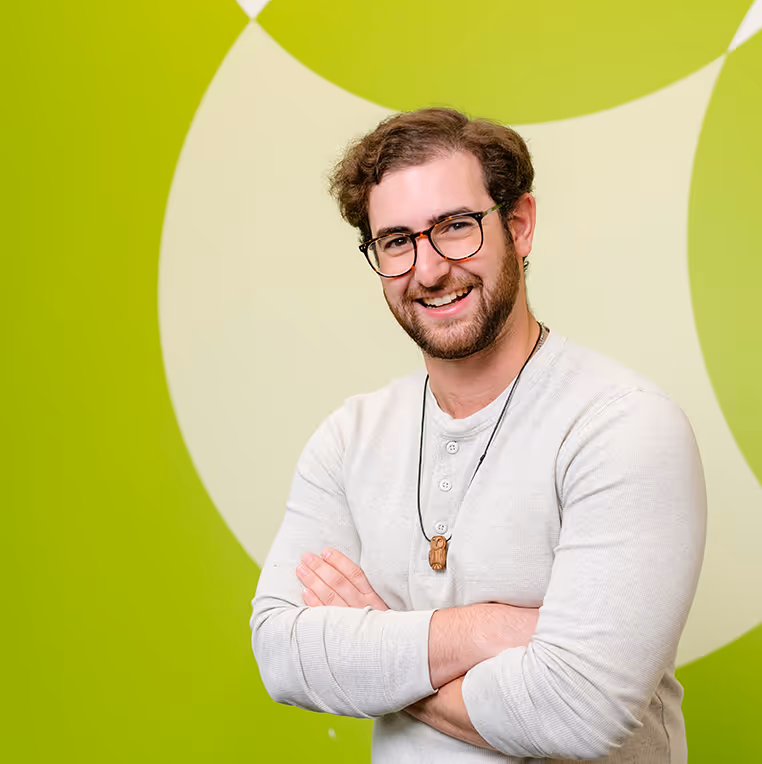 man headshot in front of green branding