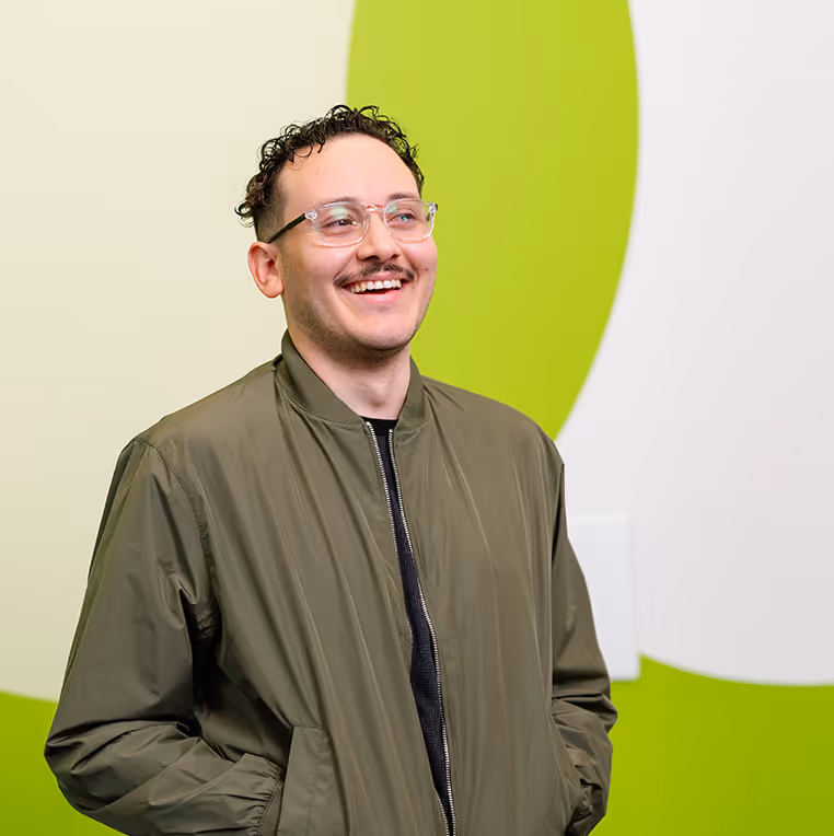 smiling man looking the other way headshot