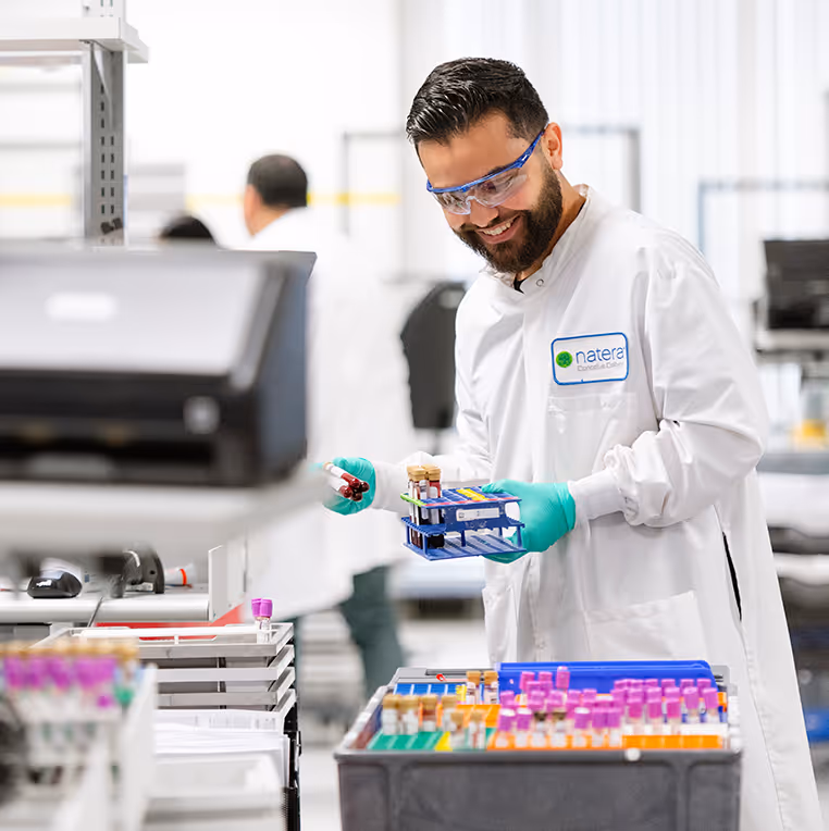 employee scanning test tubes at facility