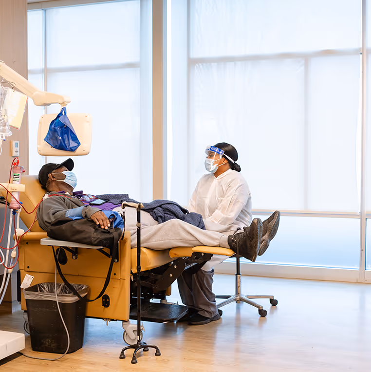 A DaVita teammate and a patient discuss treatment