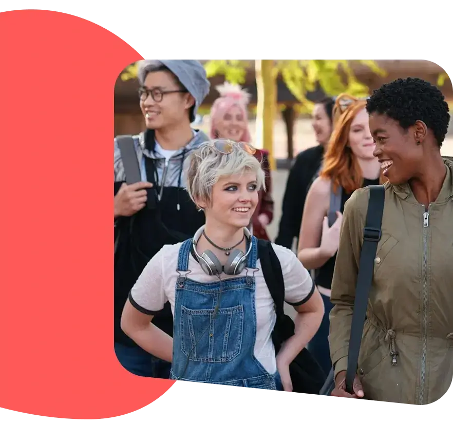 A diverse group of young adults smiling.