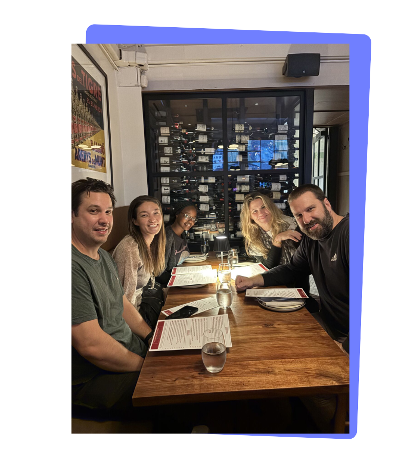 A group of people at a restaurant table