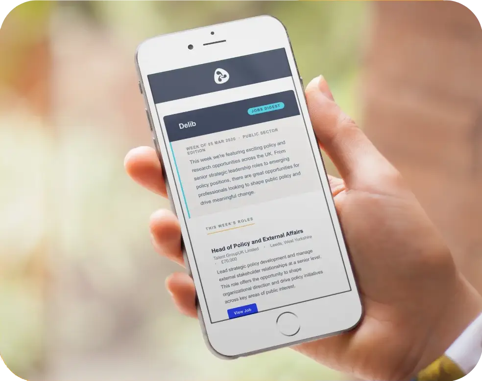 Hand holding a smartphone displaying a public sector job listing for Head of Policy and External Affairs with a salary of £70,000.
