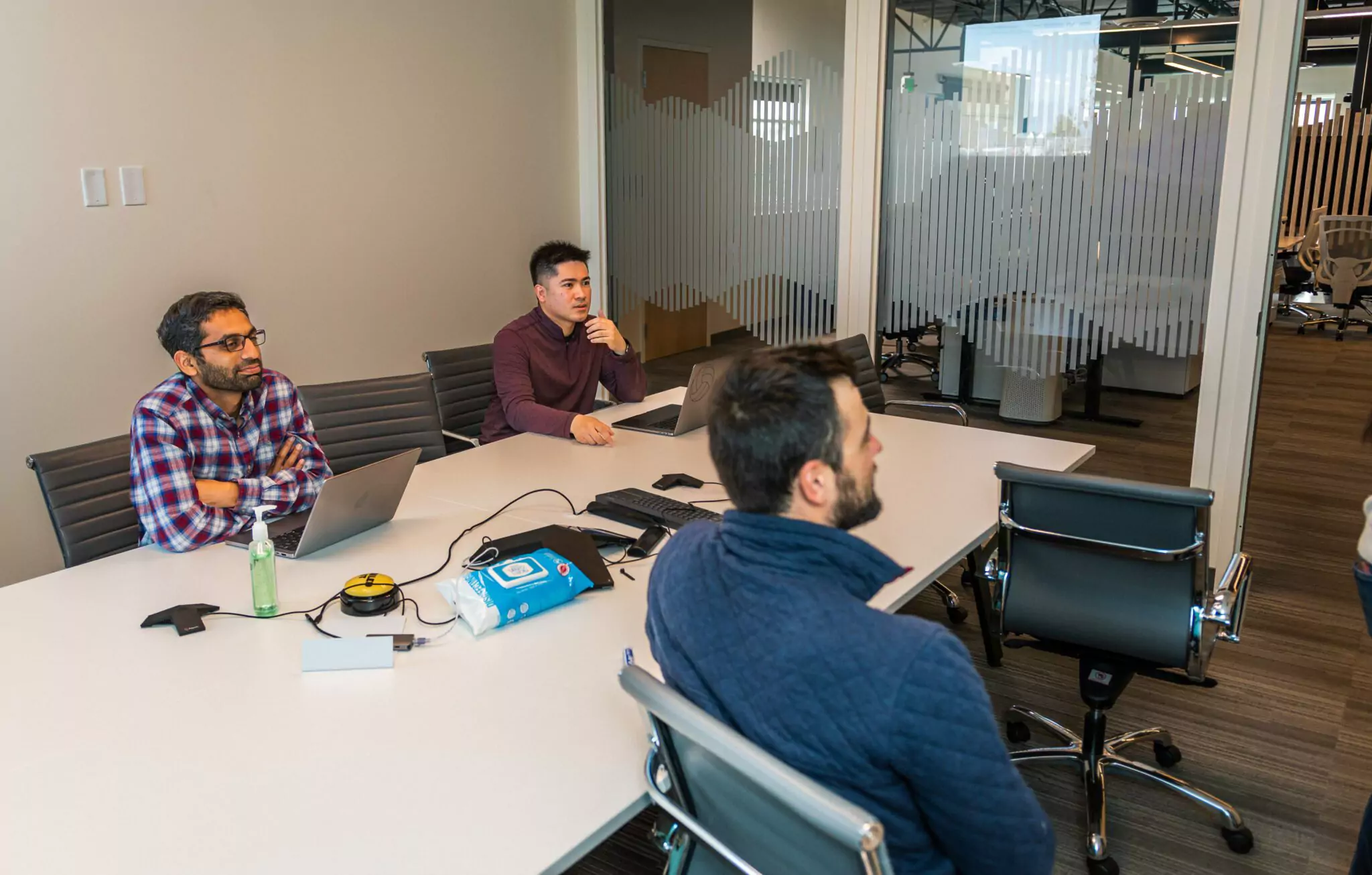 A team has a meeting in a meeting room
