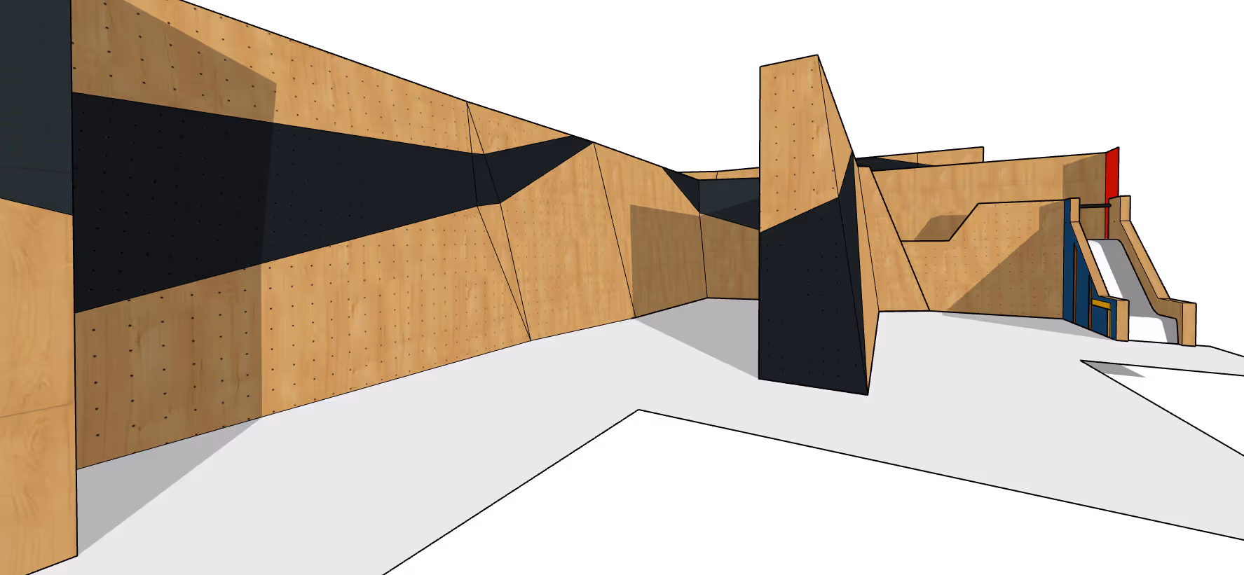 Interior view of a modern indoor climbing gym with wooden climbing walls, black climbing holds, and a white padded floor.