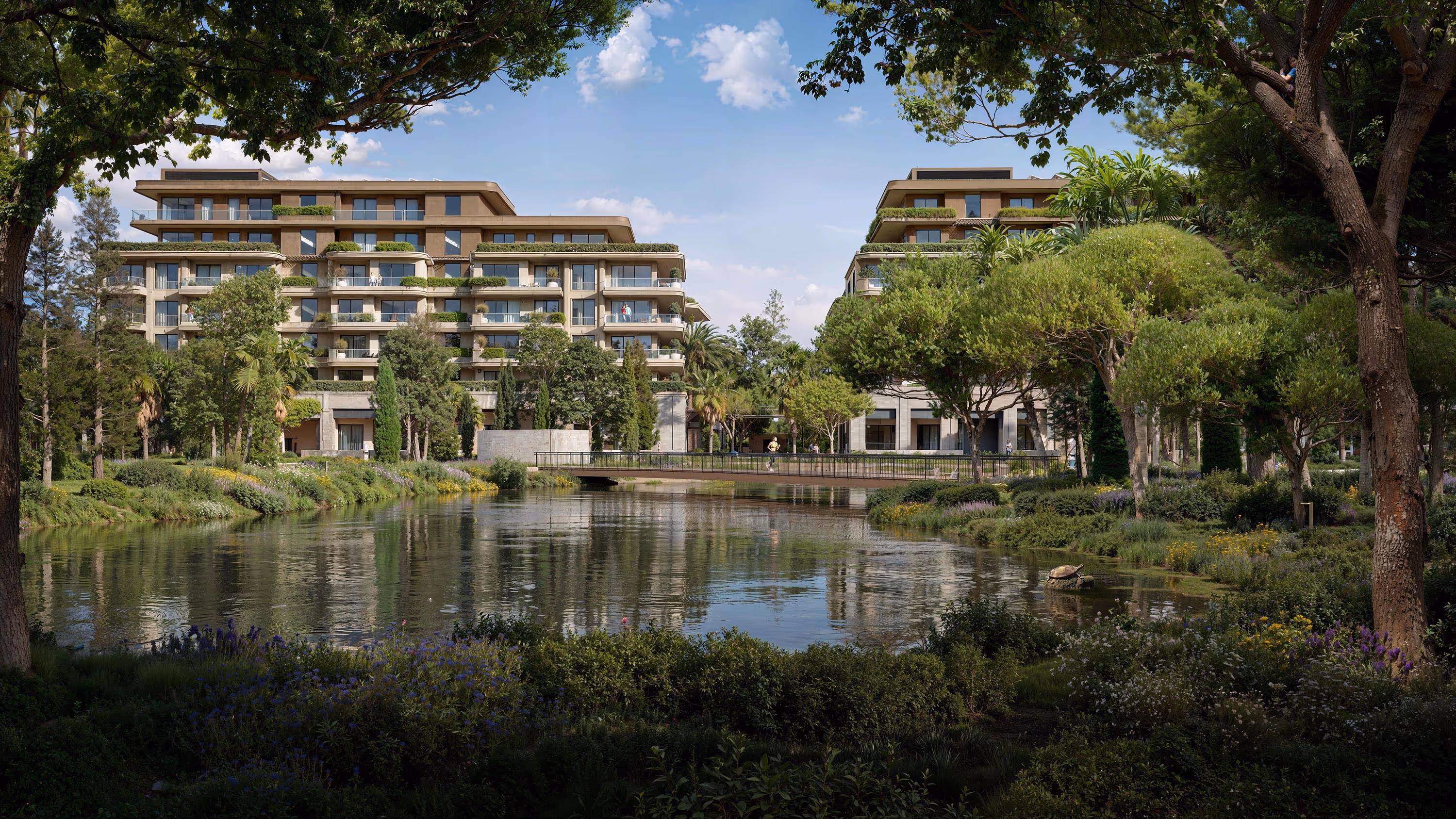 Porta Rai residences overlooking landscaped lake and gardens surrounded by greenery.