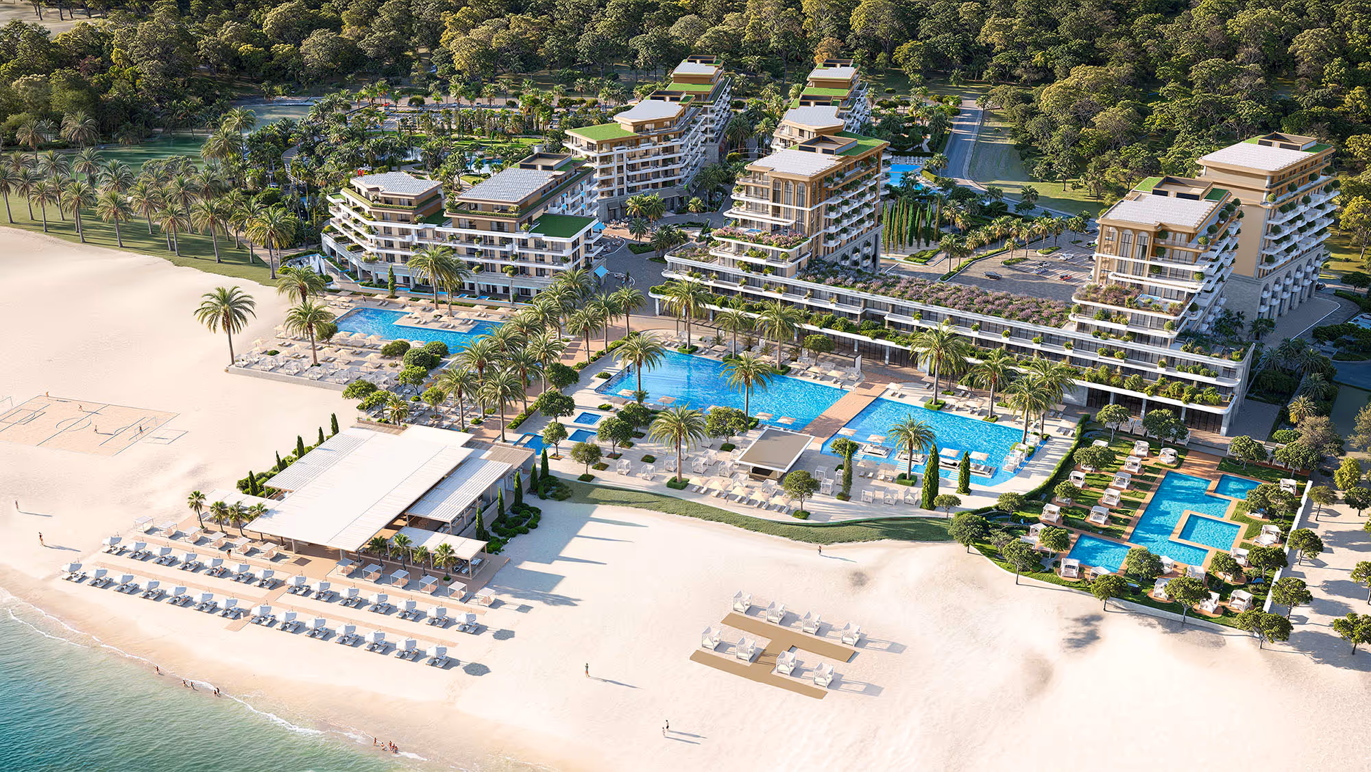 Aerial view of Porta Rai beachfront residences with swimming pools, palm trees, and private beach access.
