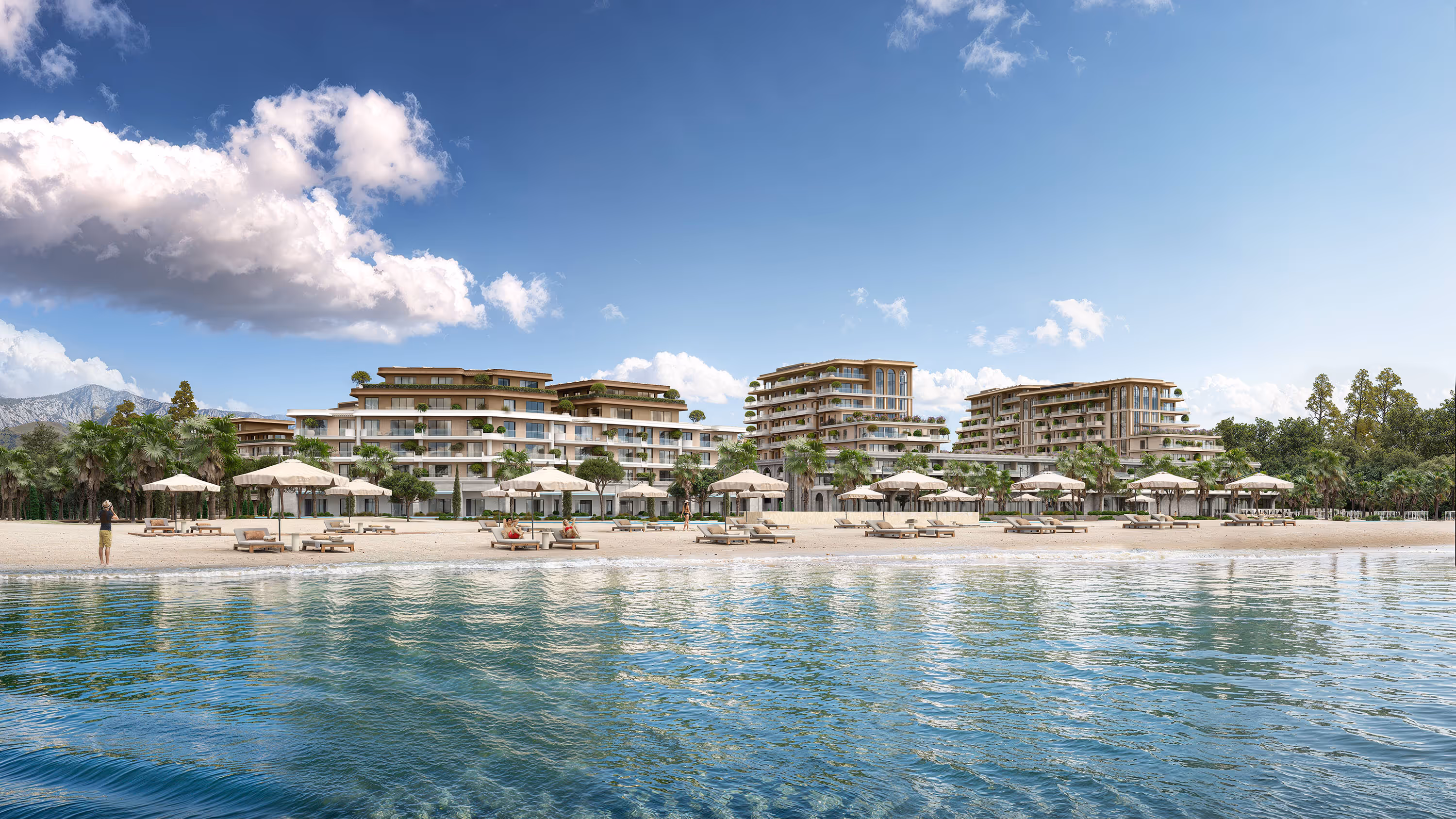 Beachfront view of Porta Rai residences with umbrellas and sunbeds along the Adriatic shore.