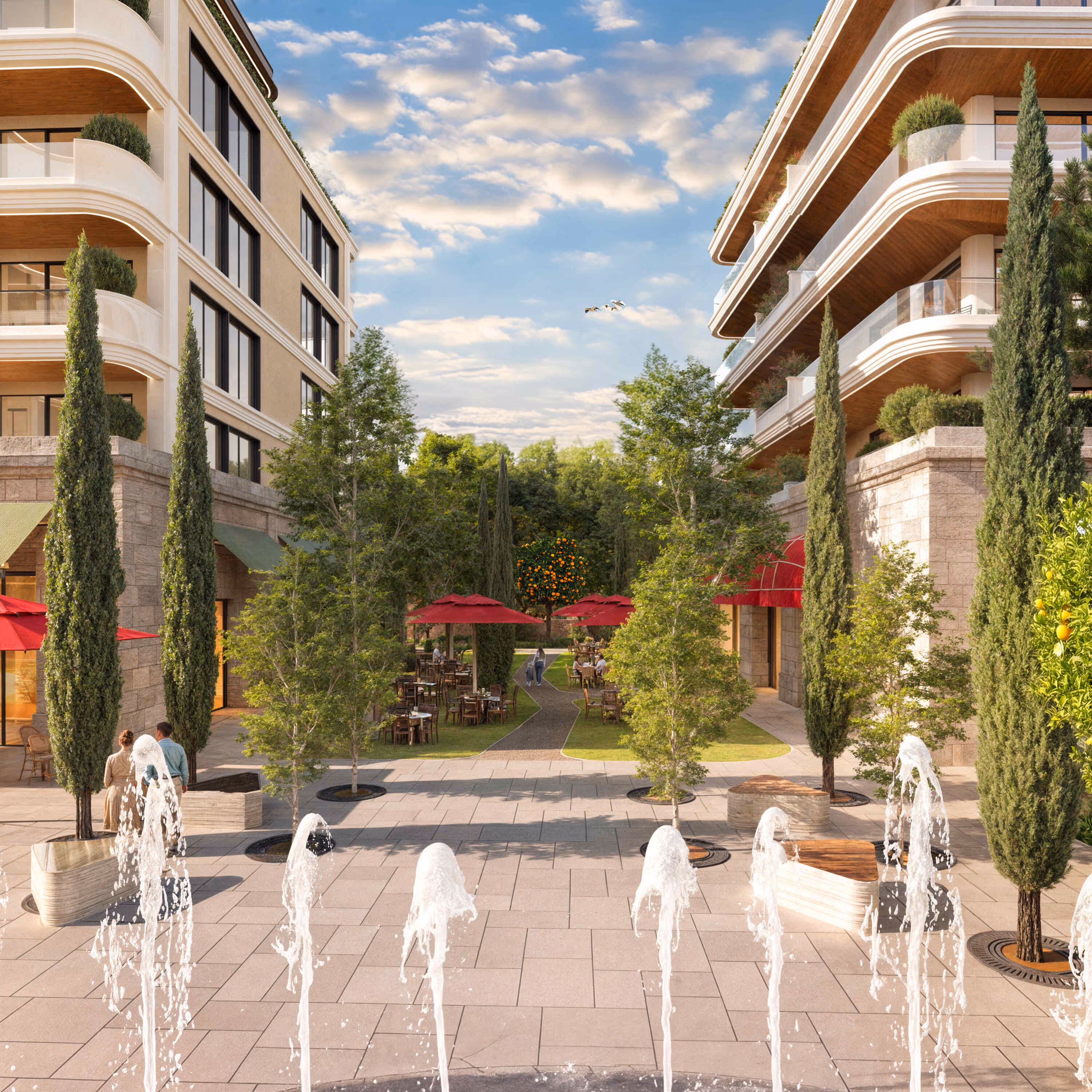 Central courtyard at Porta Rai featuring fountains, trees, and outdoor dining beneath elegant residences.