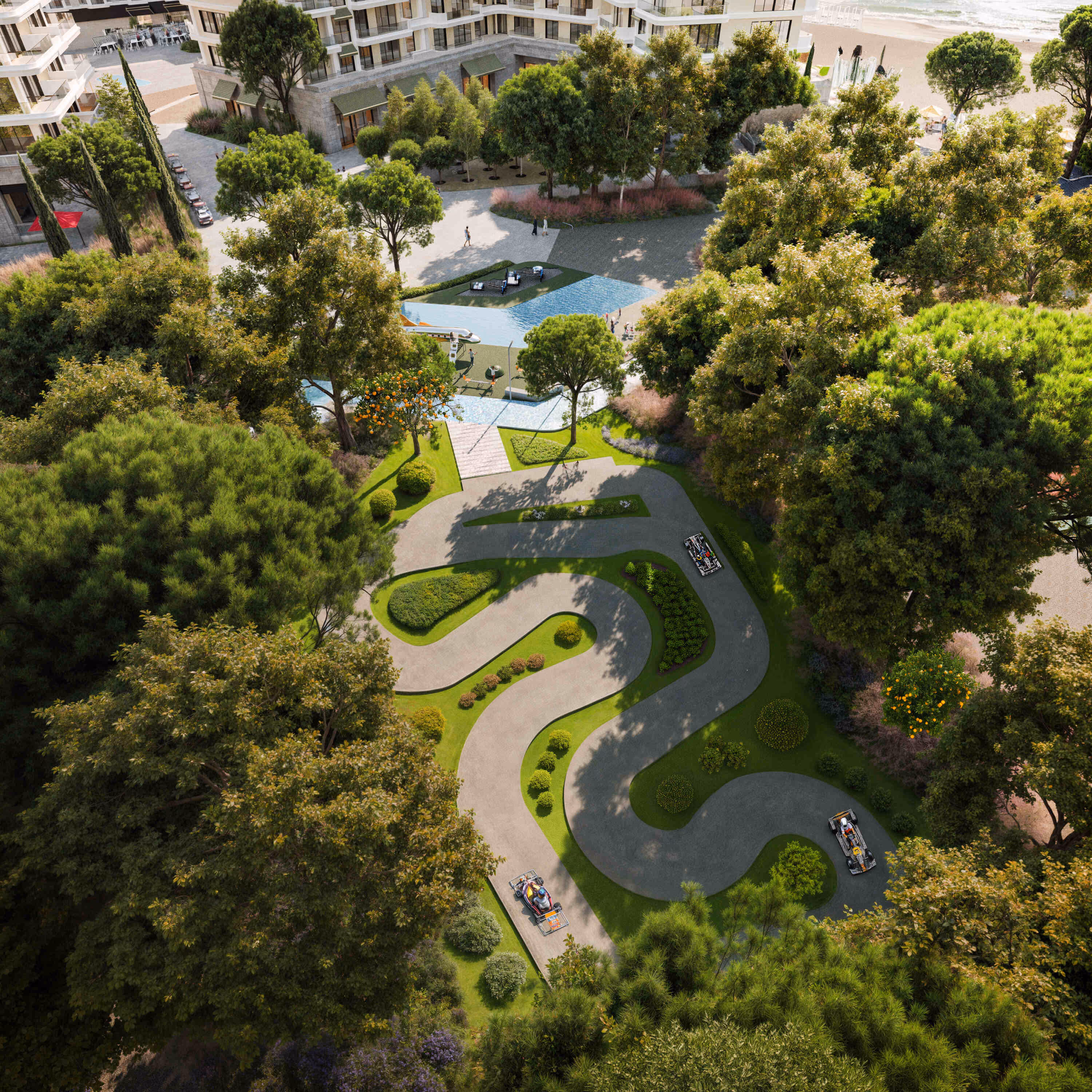 Aerial view of Porta Rai’s landscaped go-kart track surrounded by lush trees and walking paths.