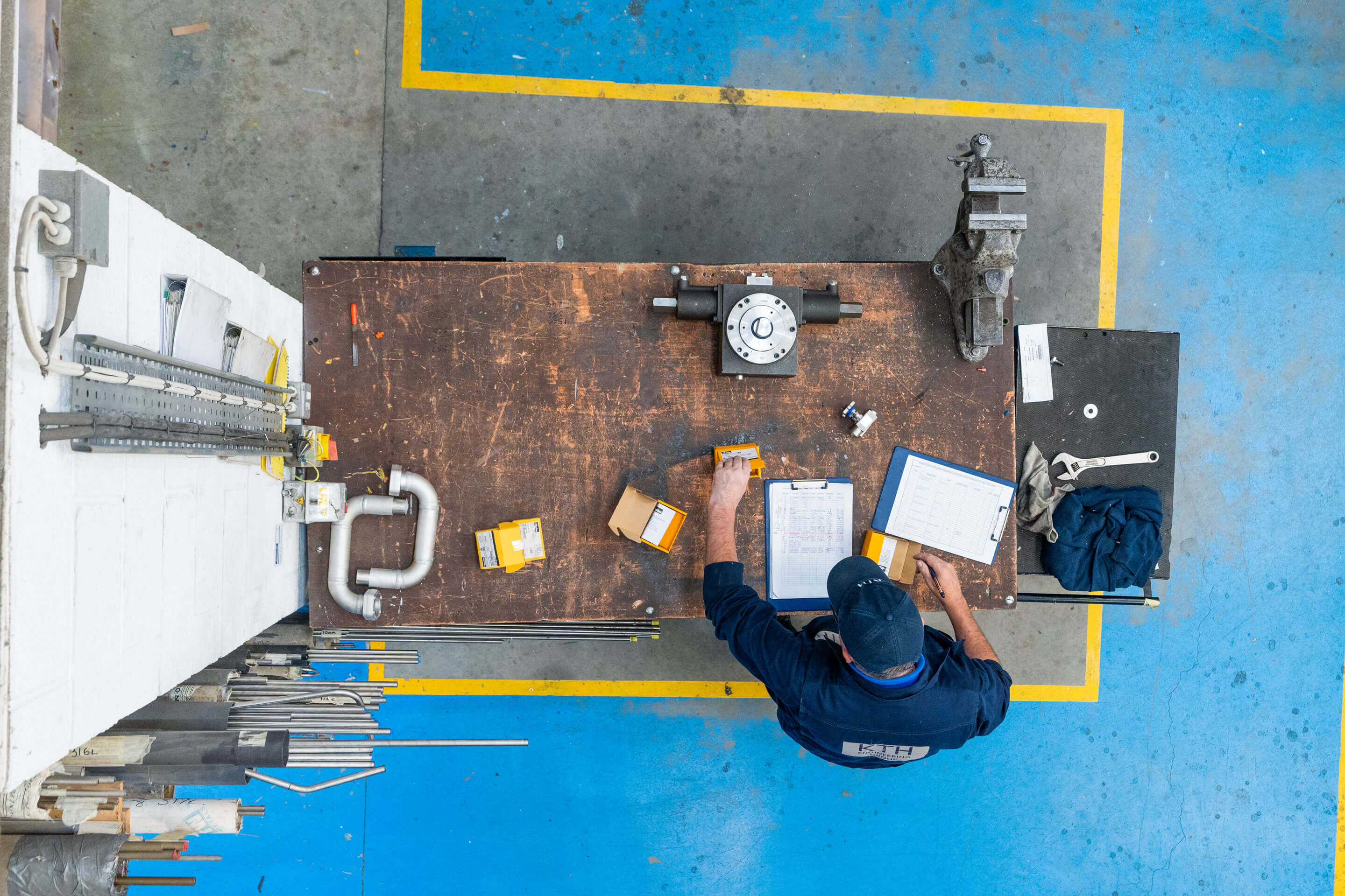 Top down shot of an employee working at his work bench