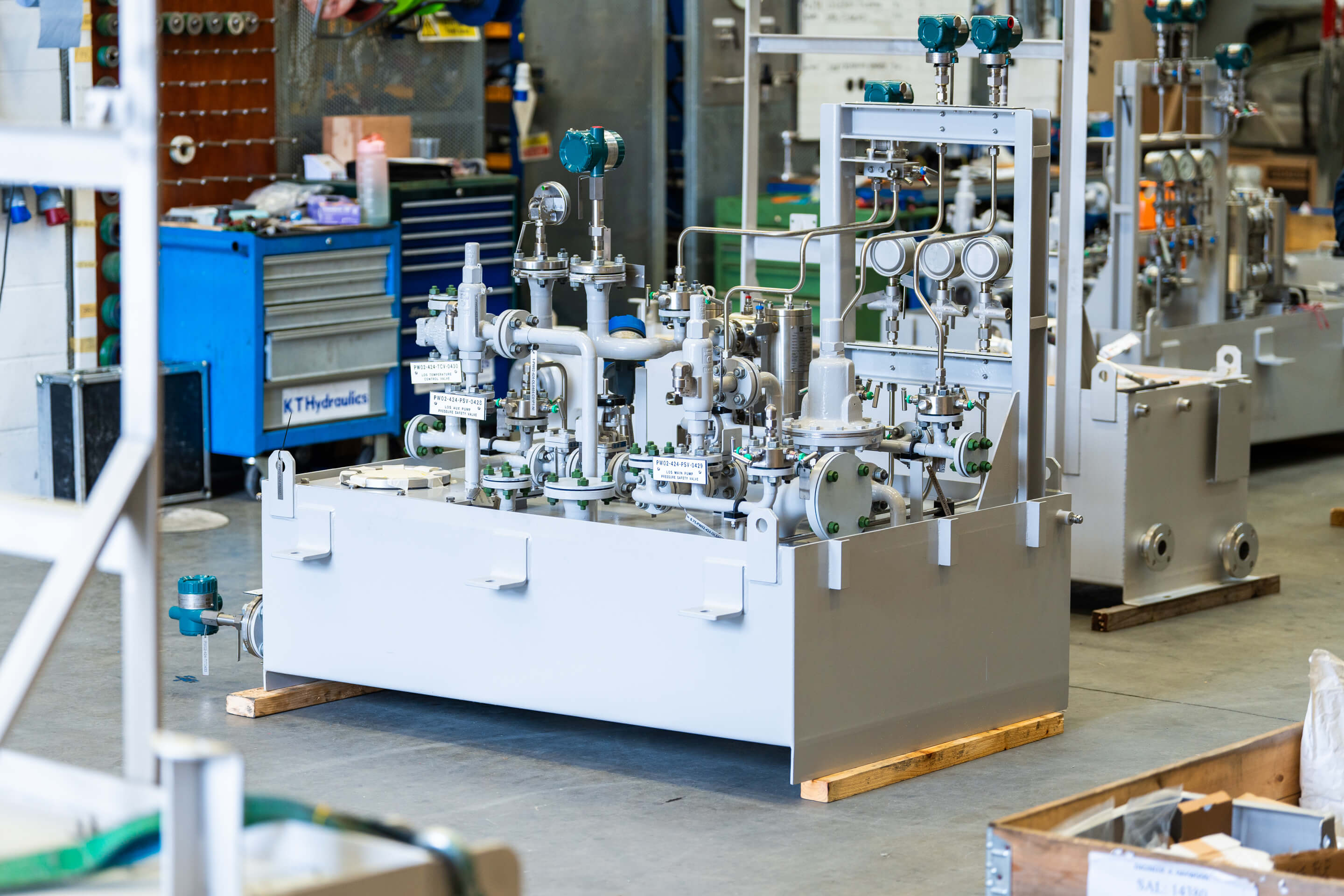 A wide shot of a piece of hydraulic equipment on the factory floor at KT Hydraulics
