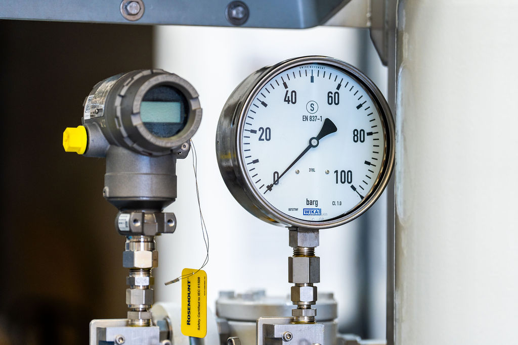 A close up of a pressure guage