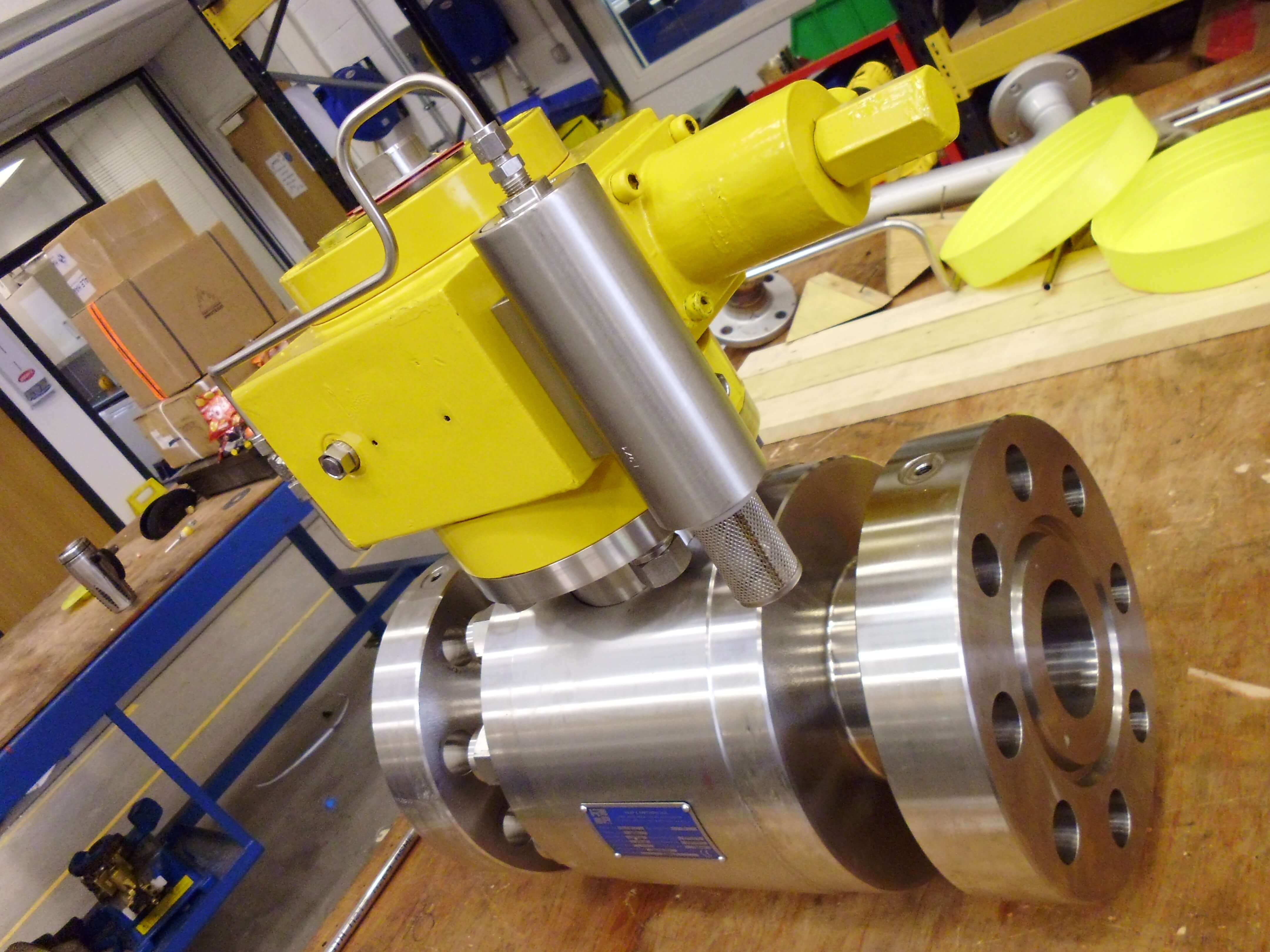 An Image of an Actuator on a work bench at the KT Hydraulics factory