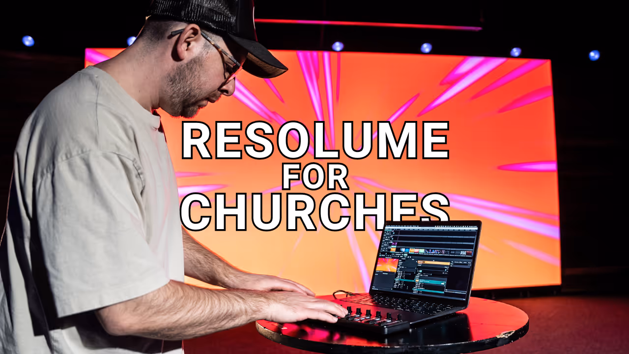 Operator using Resolume for church media on stage laptop.