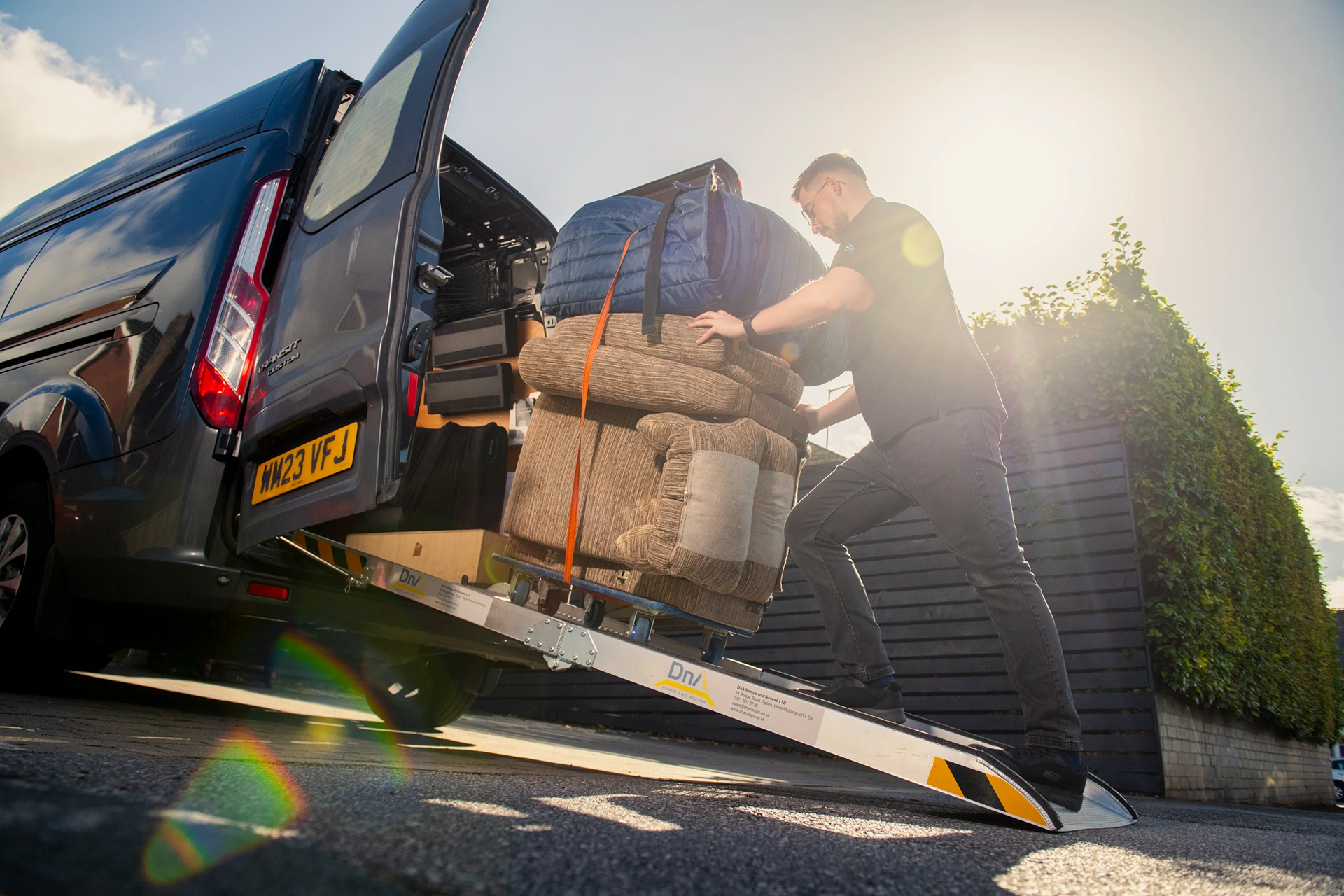 Seating specialist unloading chairs from van