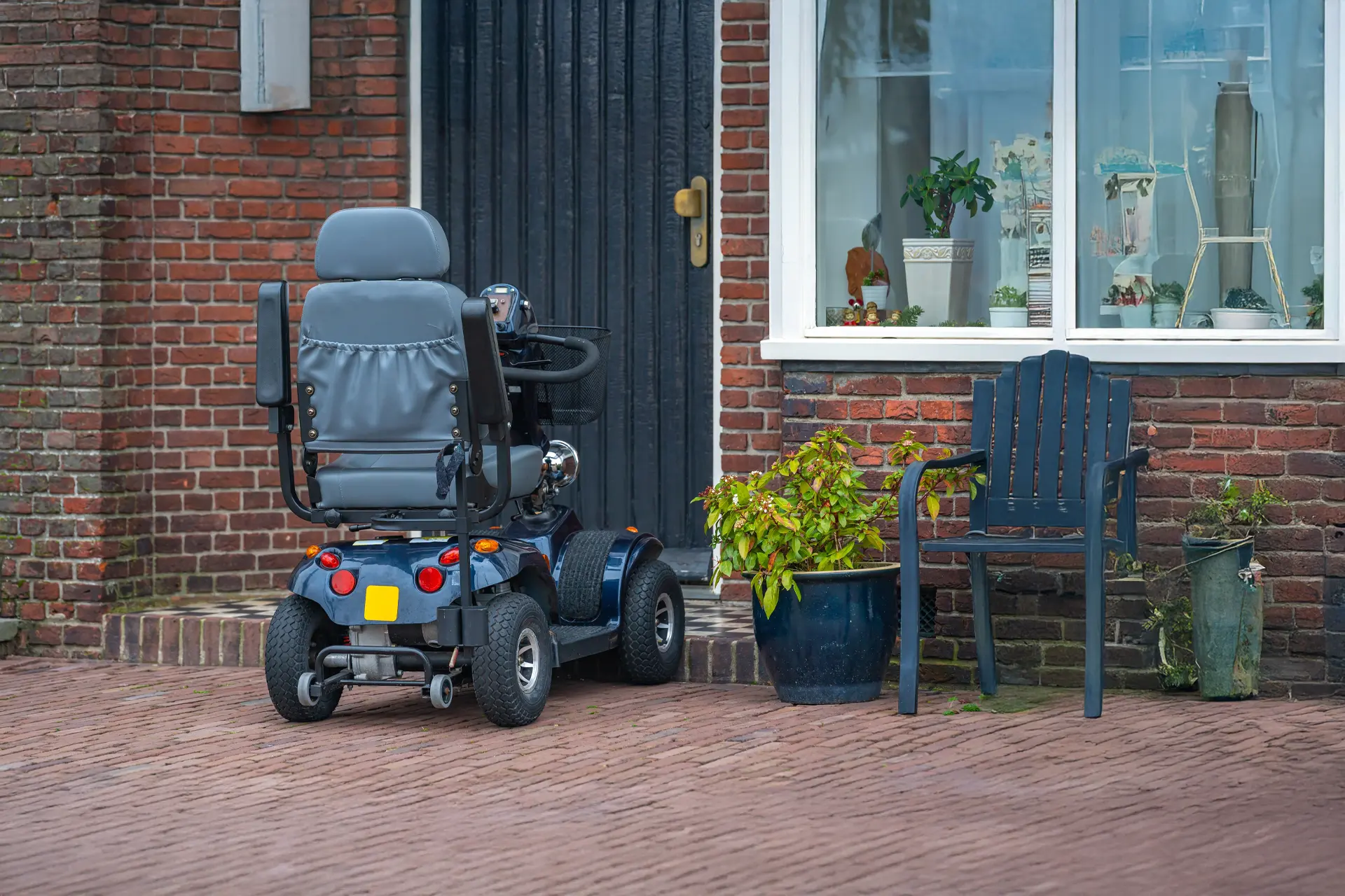 Mobility scooter parked outside house