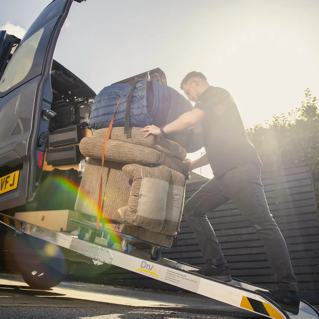 seating specialist getting chair out of van