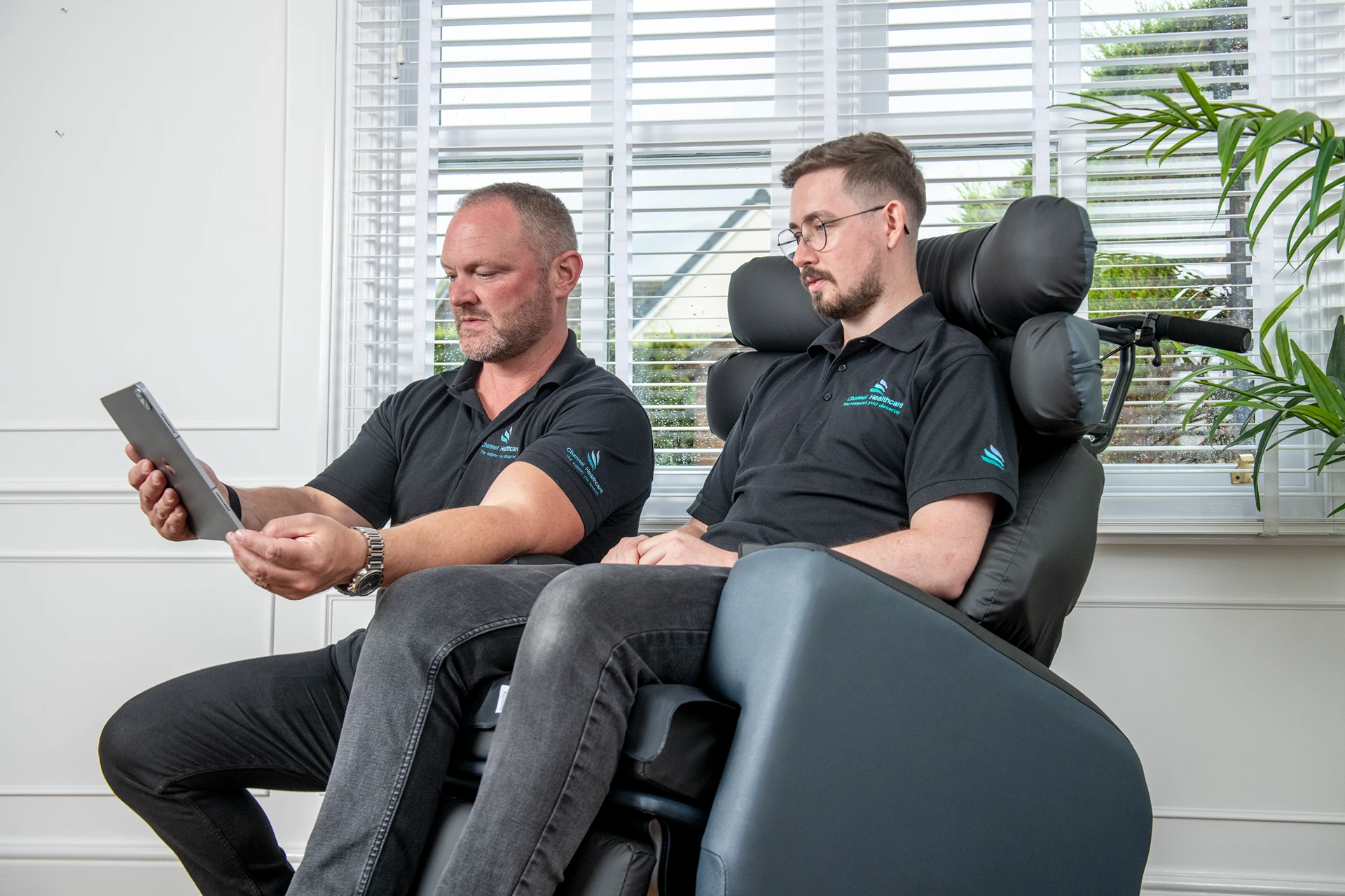 seating specialist helping client in chair
