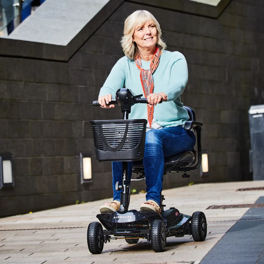 Woman on mobility scooter outdoors