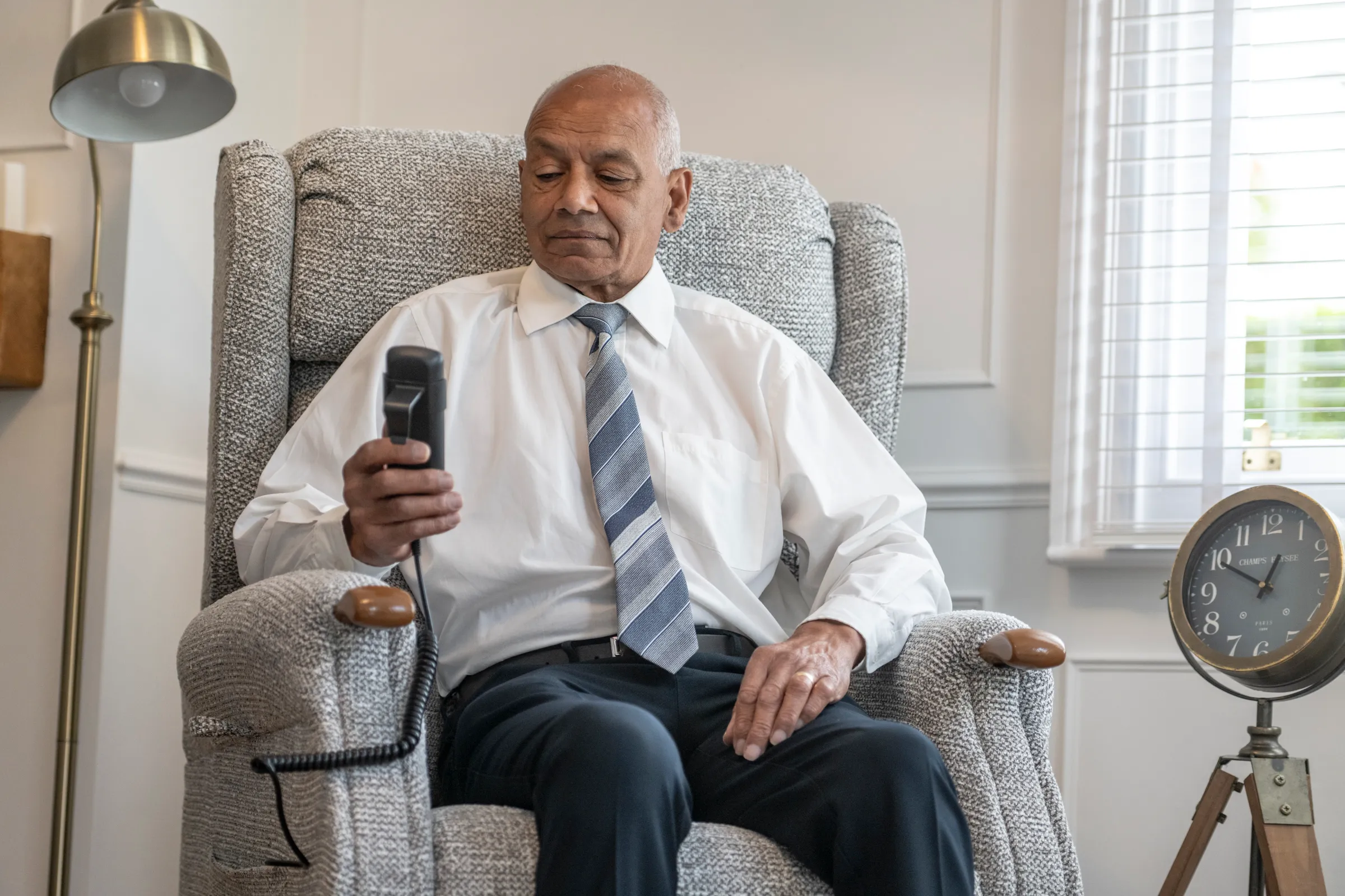 Customer sat in riser recliner using tilt controls