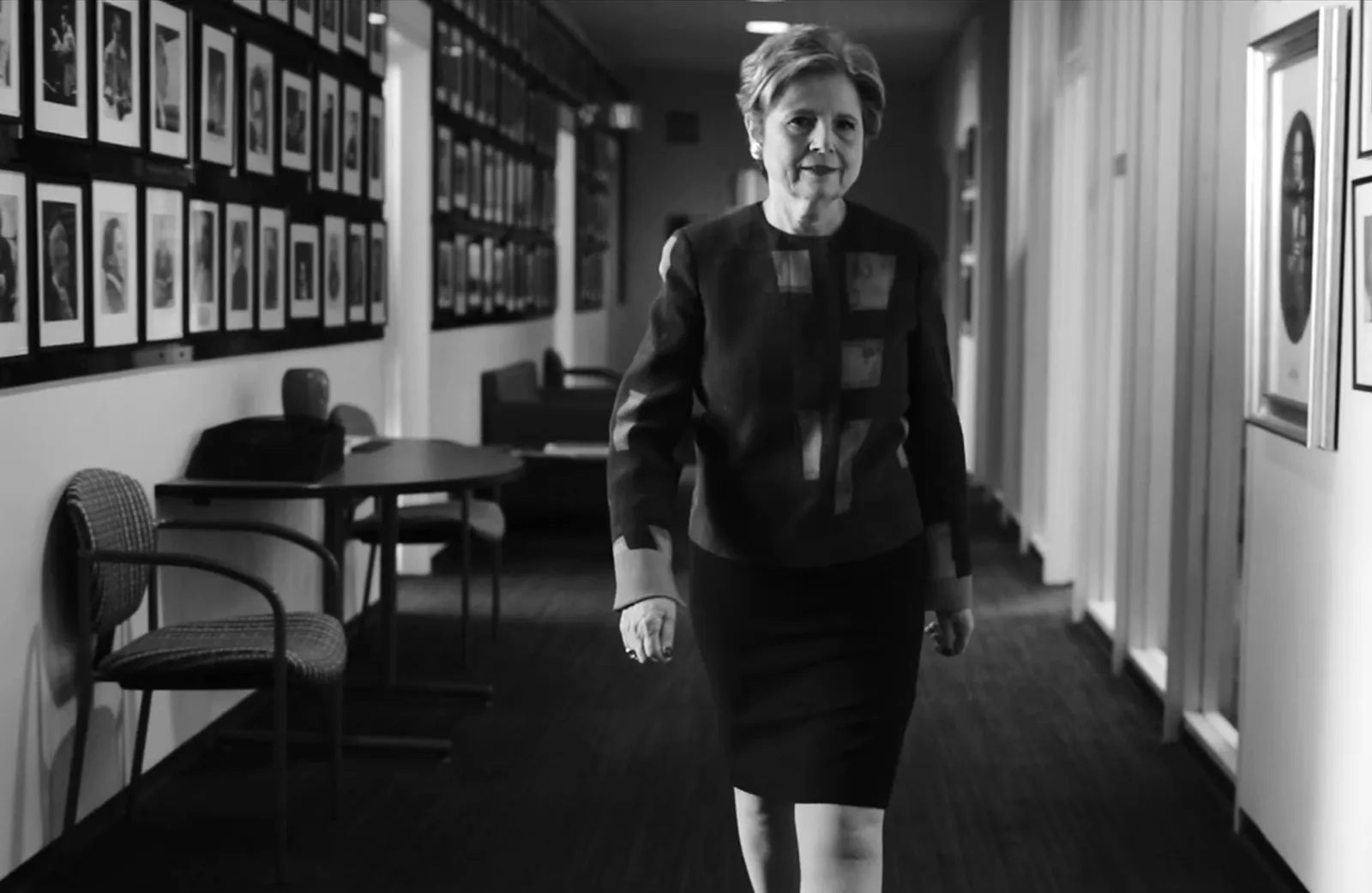 business woman walking down a hall