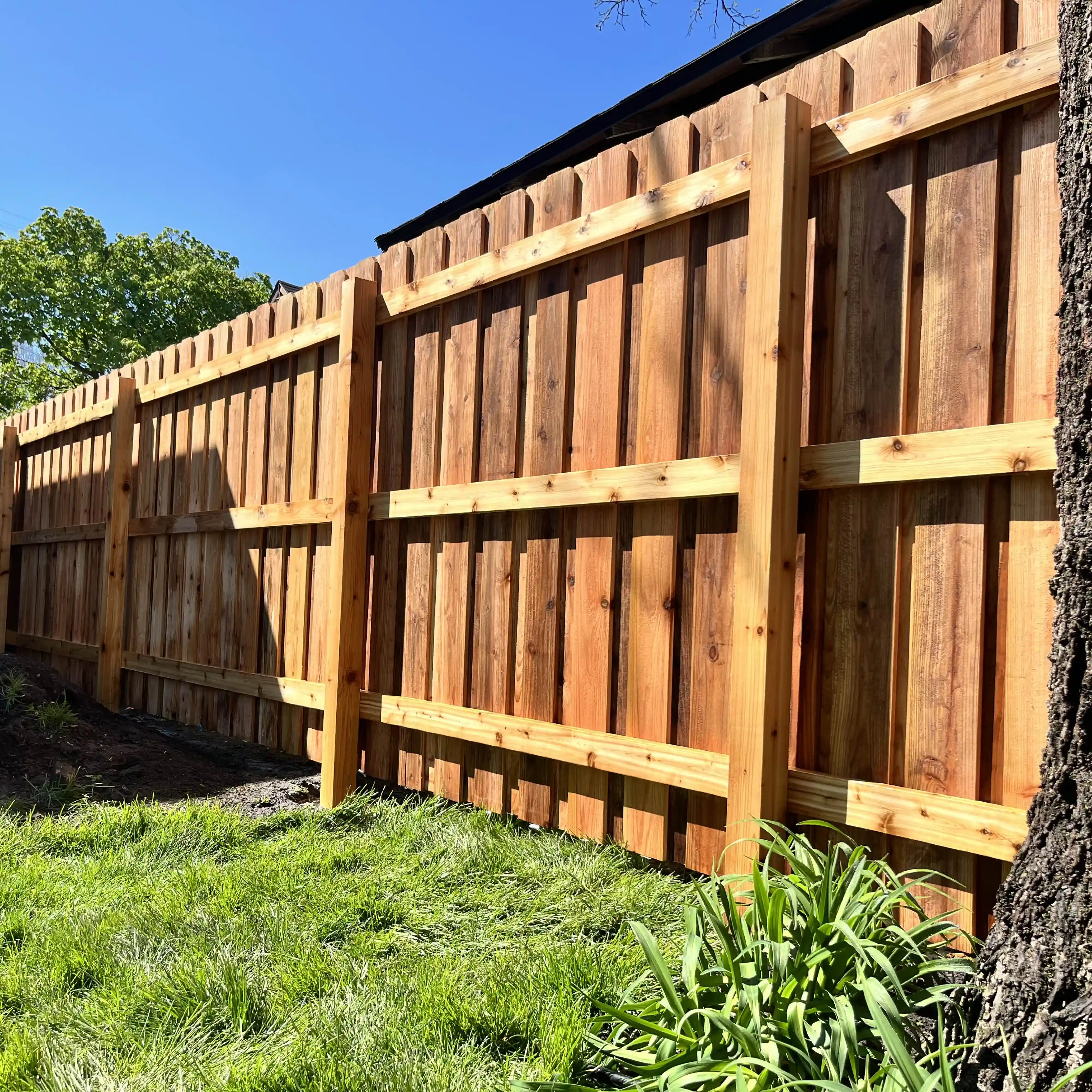 wood fence install residential backyard