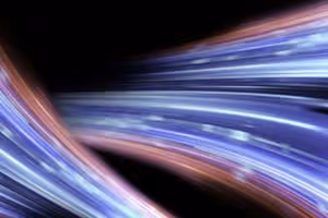 Abstrakte Lichtstreifen in Blau und Rot auf schwarzem Hintergrund.